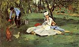 The Monet Family In The Garden by Edouard Manet